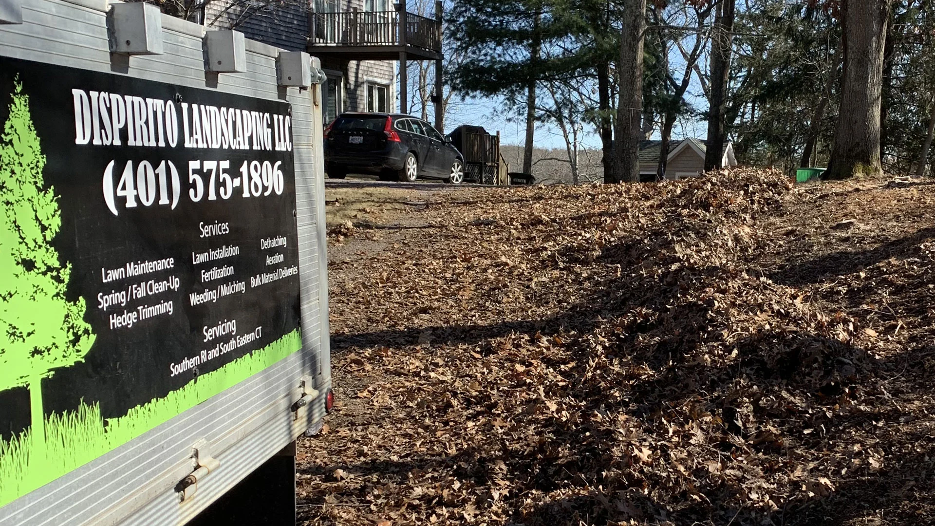 DiSpirito Landscaping LLC work trailer at a Westerly, RI home property.